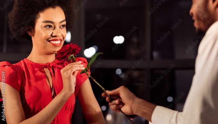 Man giving lady a rose