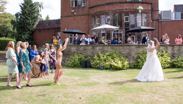 Bride throwing the bouquet