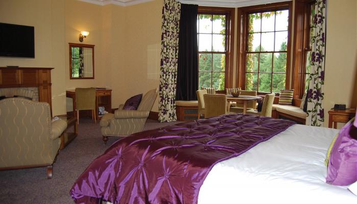 Balgeddie House Hotels Honeymoon Suite with seating area overlooking the Gardens Balgeddie House Hotels Honeymoon Suite with seating area overlooking the Gardens