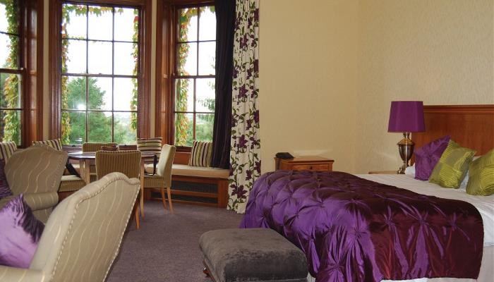Honeymoon Suite with seating area at Balgeddie House Hotel Honeymoon Suite with seating area at Balgeddie House Hotel